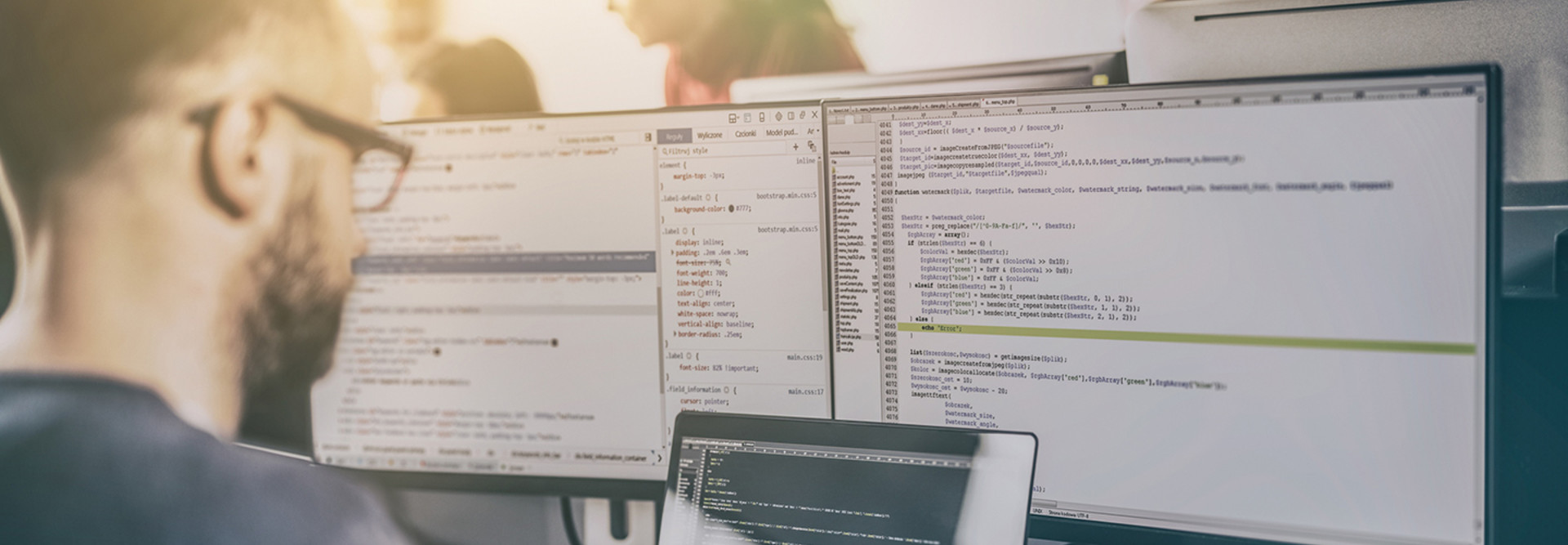 An IT security professional working on code 