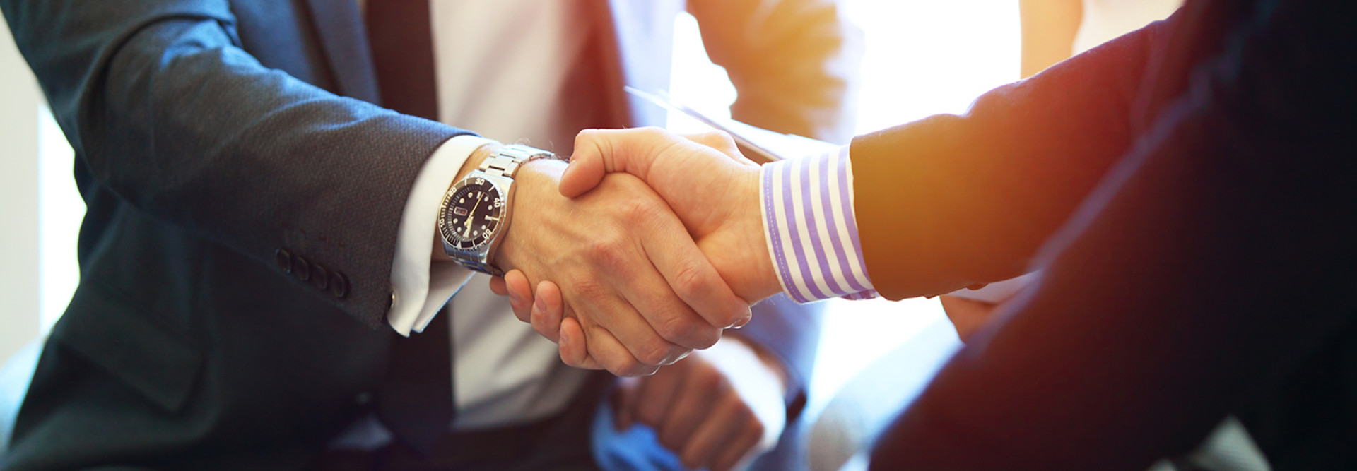Bank fintech partnership business people handshake 