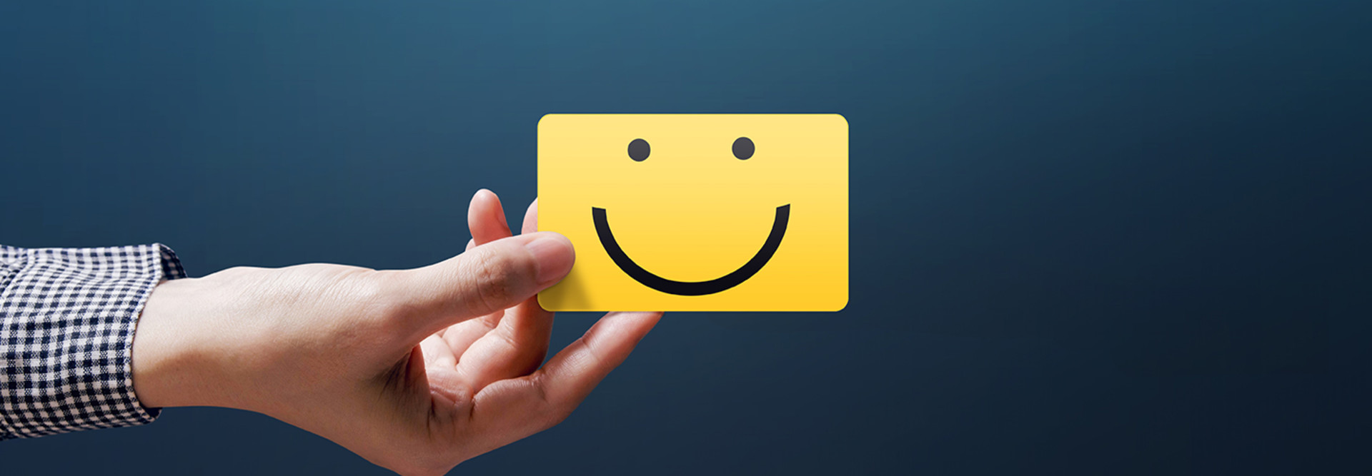 A smiley face on a post-it note 