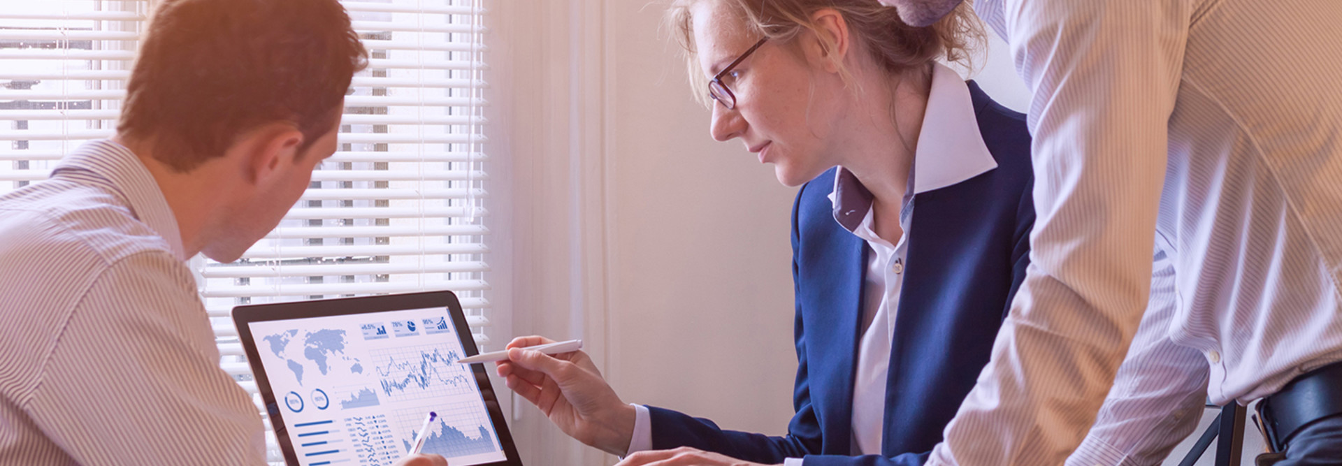 Nonprofit workers look at data analytics dashboard 