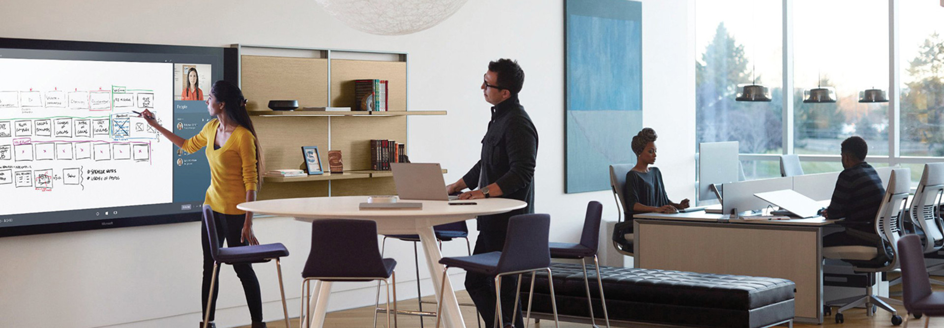 Windows 10 being used in the workplace on a Surface Hub 