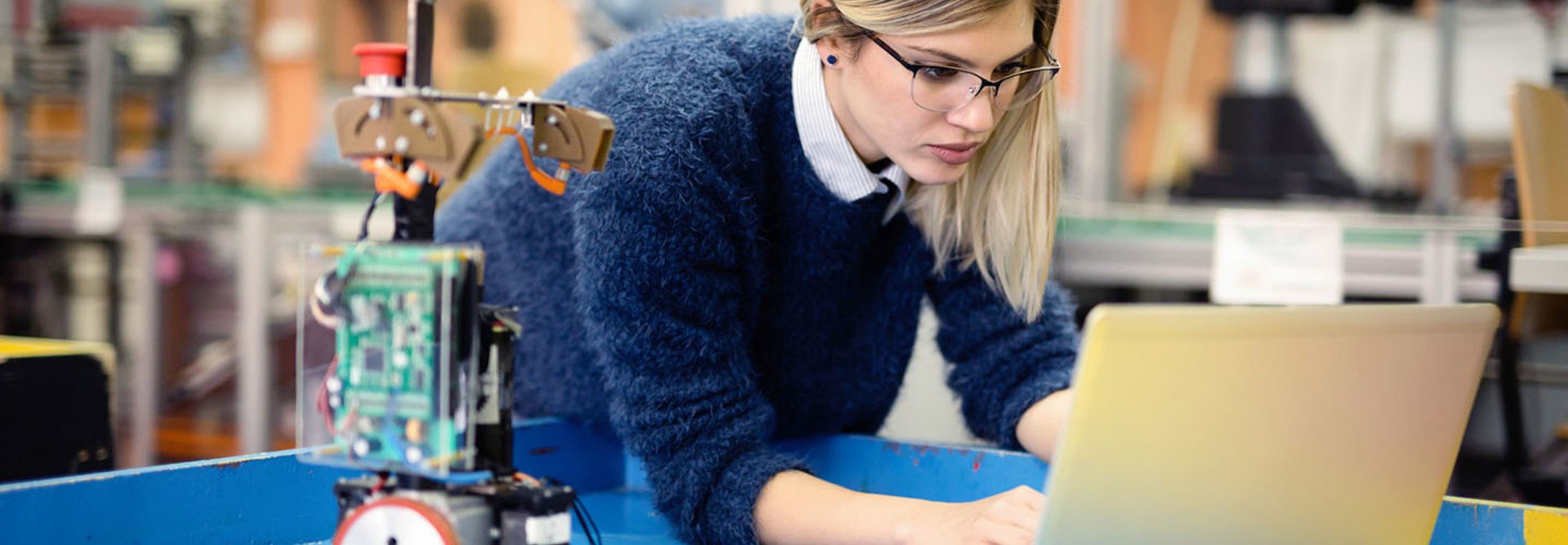 Young woman engineer working on robotics project
