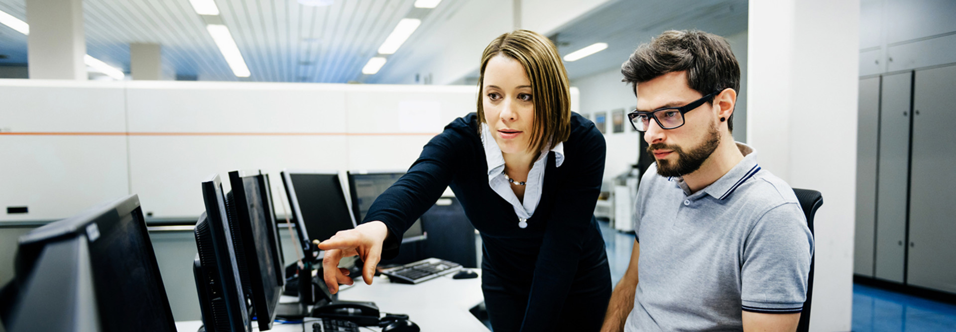 Two IT pros working on cybersecurity 