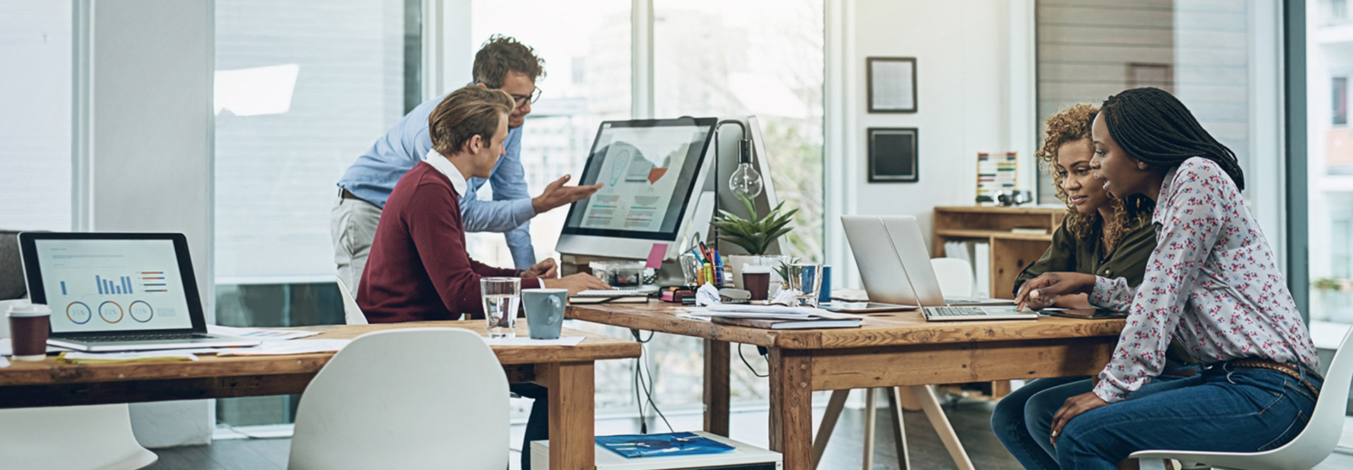 People working on computers in a small business office 