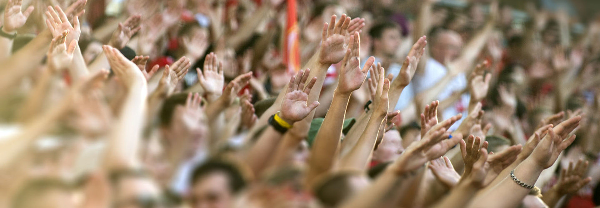Football fans clapping on the podium of the stadium