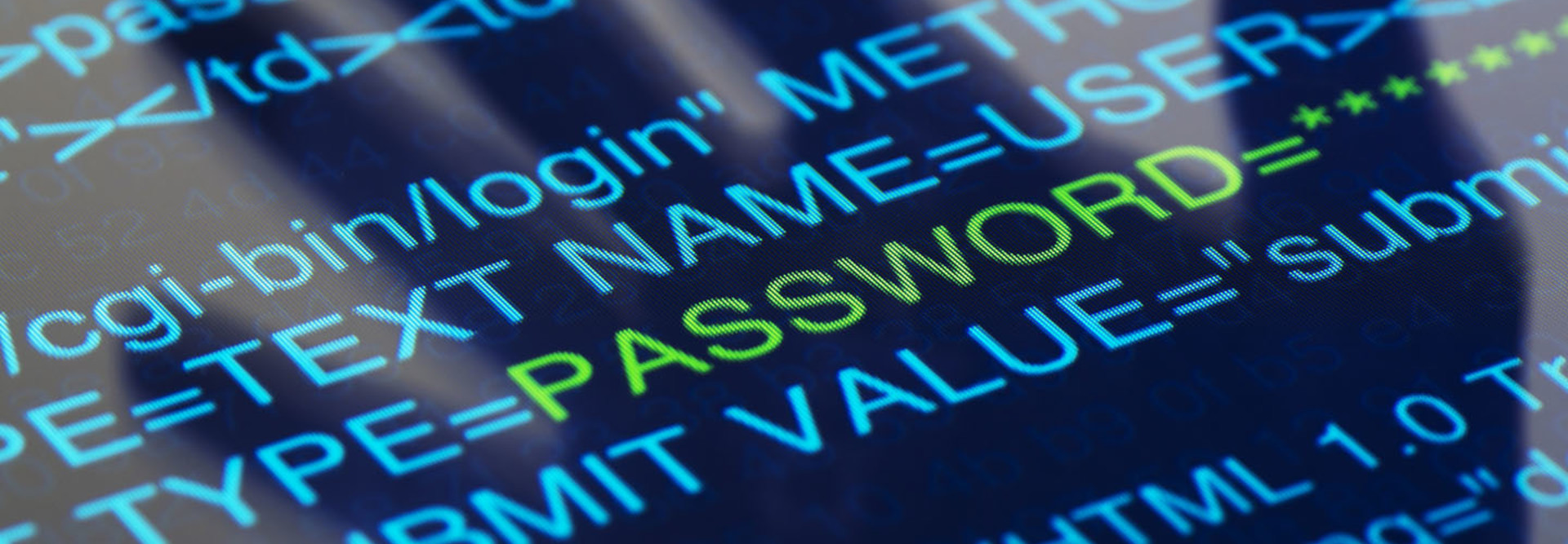 The shadow of a hand is falling on a computer screen with a HTML login script.