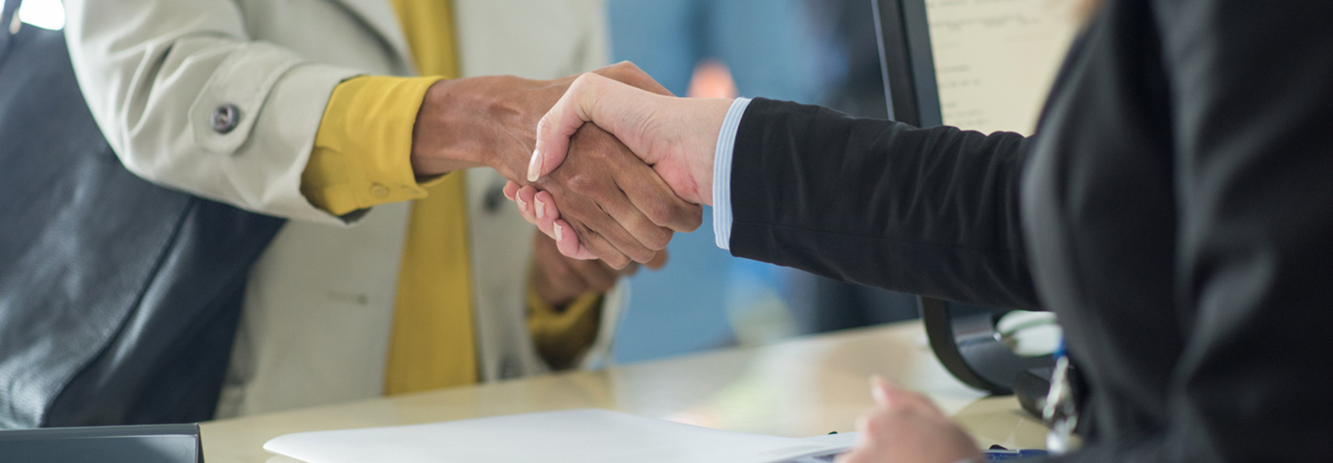 Banker shakes customer's hand