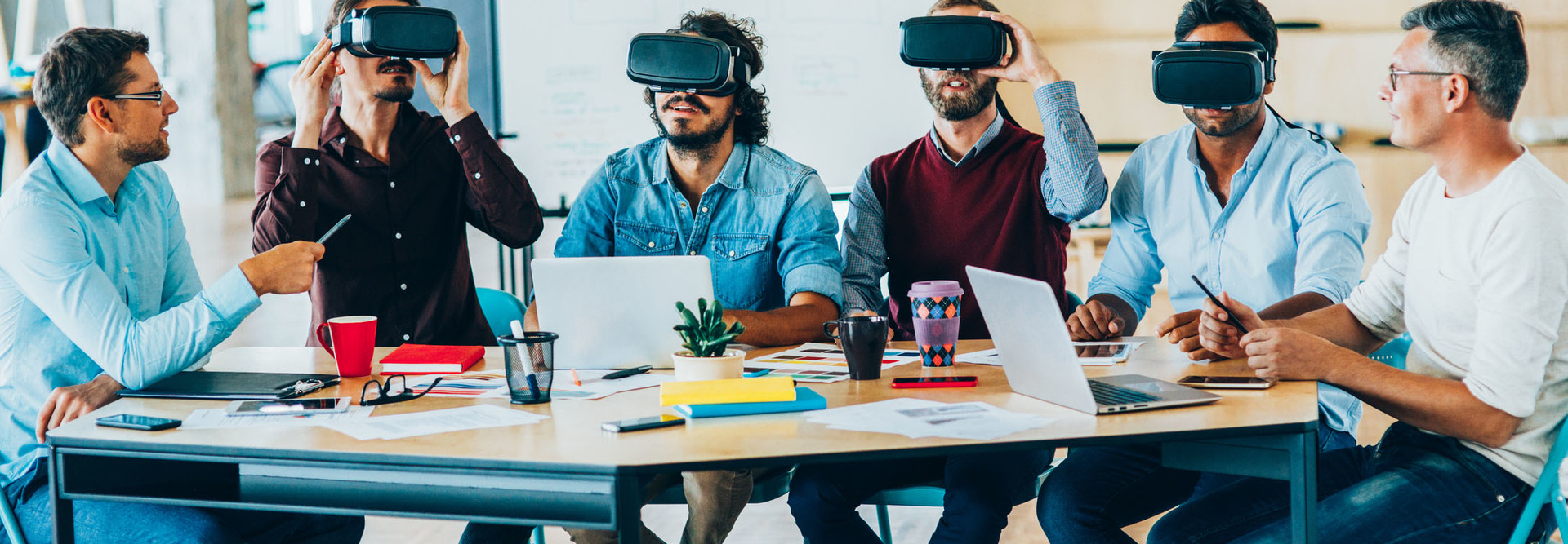  Group of people testing Virtual Reality Simulator.