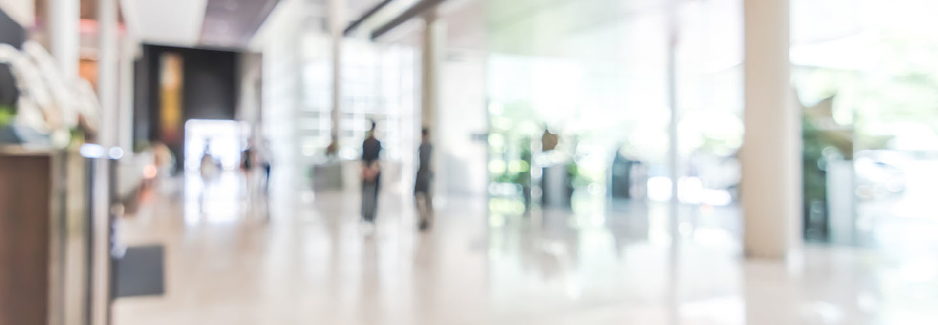 bank building lobby blur background interior view toward reception hall, modern luxury white room space with blurry corridor and building glass wall window