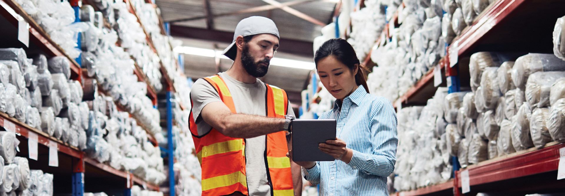 man and woman in warehouse