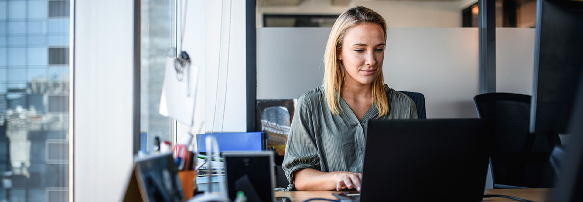 Employee working on laptop in office