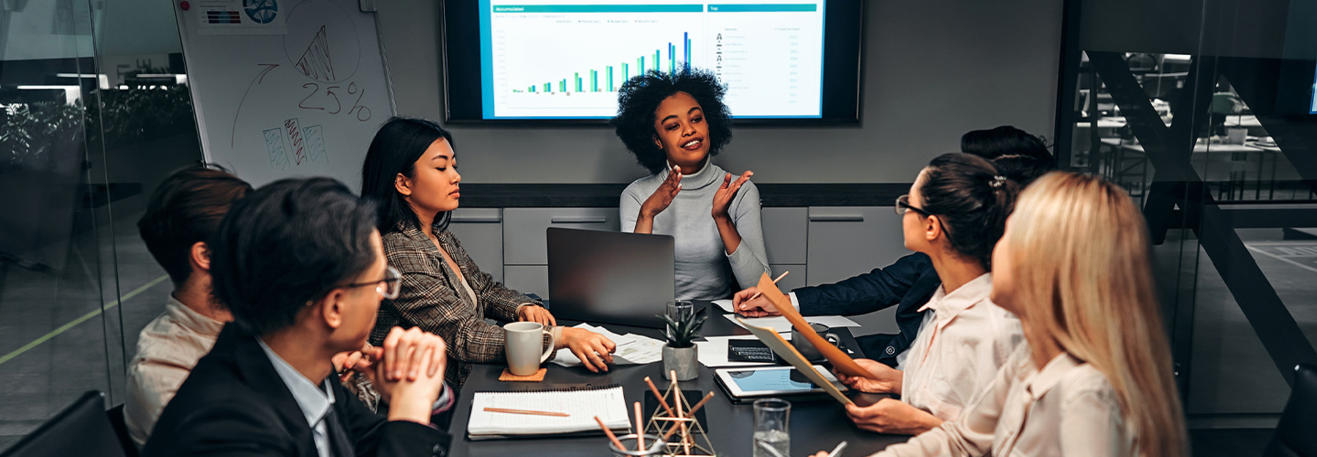 Person presenting in conference room