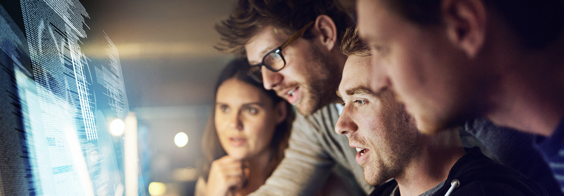 Co-workers looking at computer