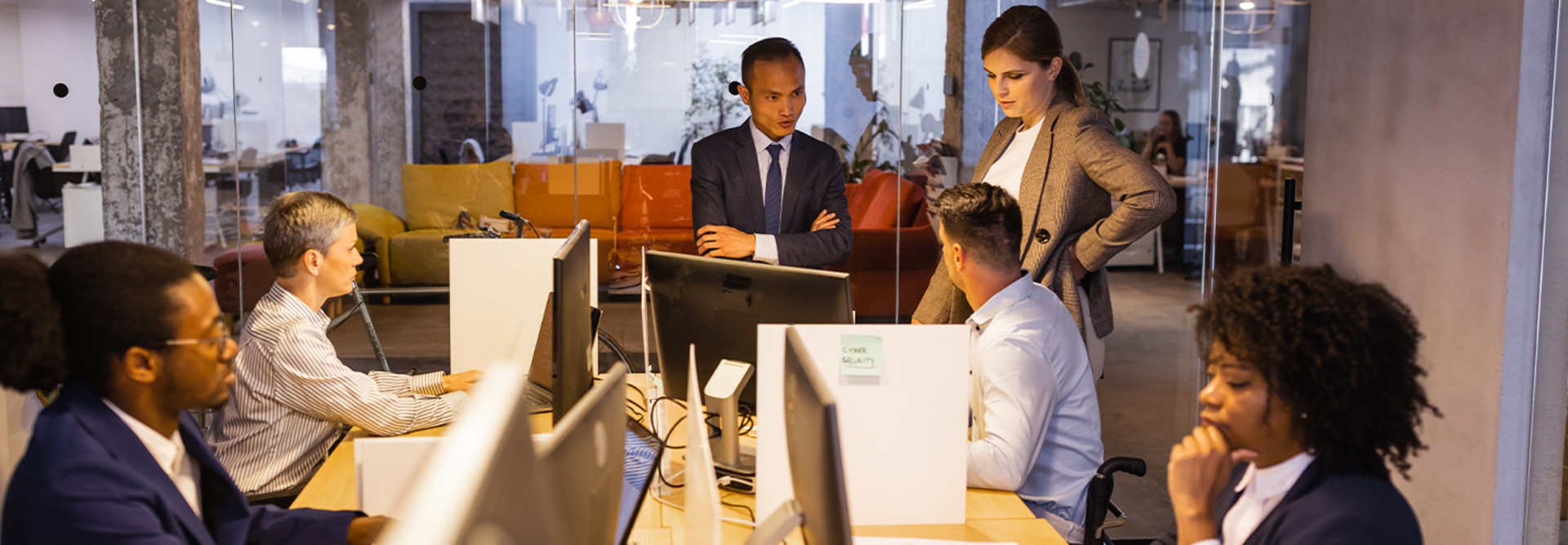 Business people at computers meeting