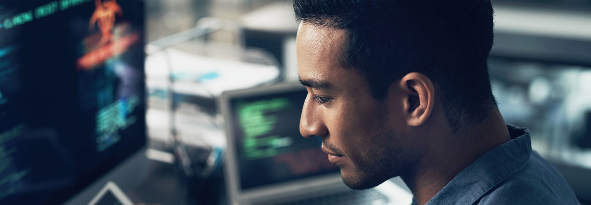 Person using digital tablet and computer