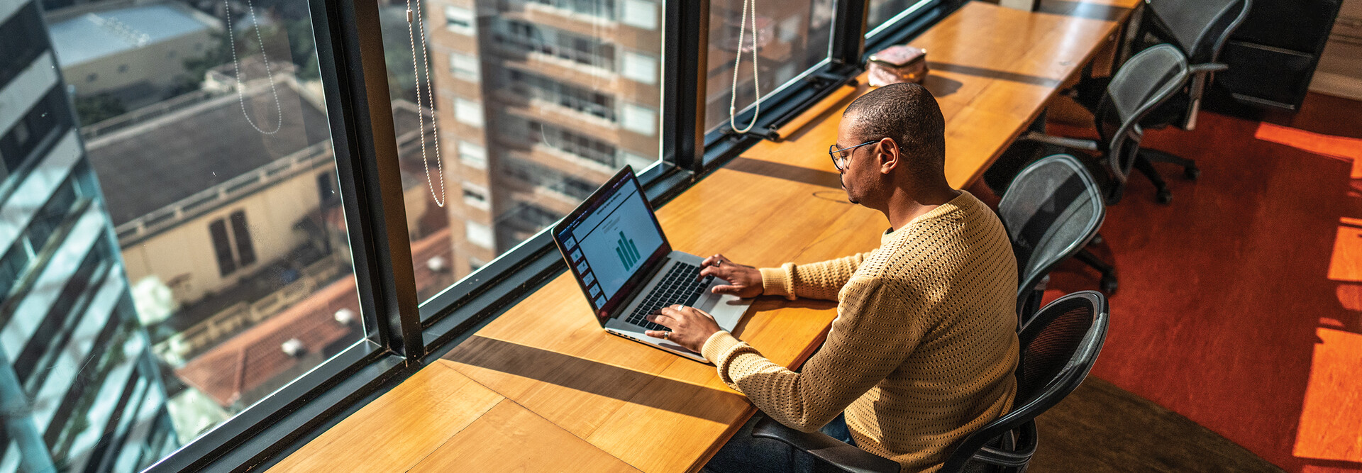 Person working in the office on a laptop