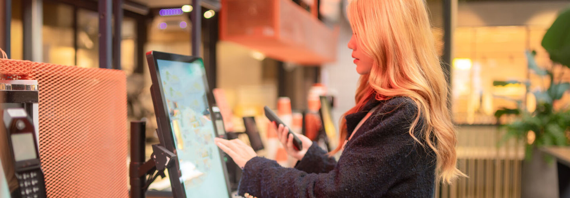 Consumer using self-service kiosk