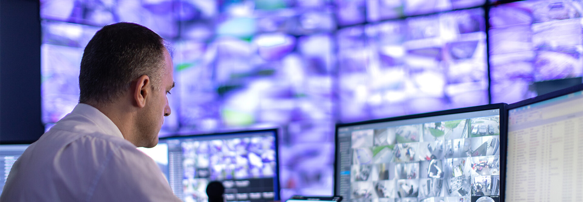 Man working in a security surveillance station