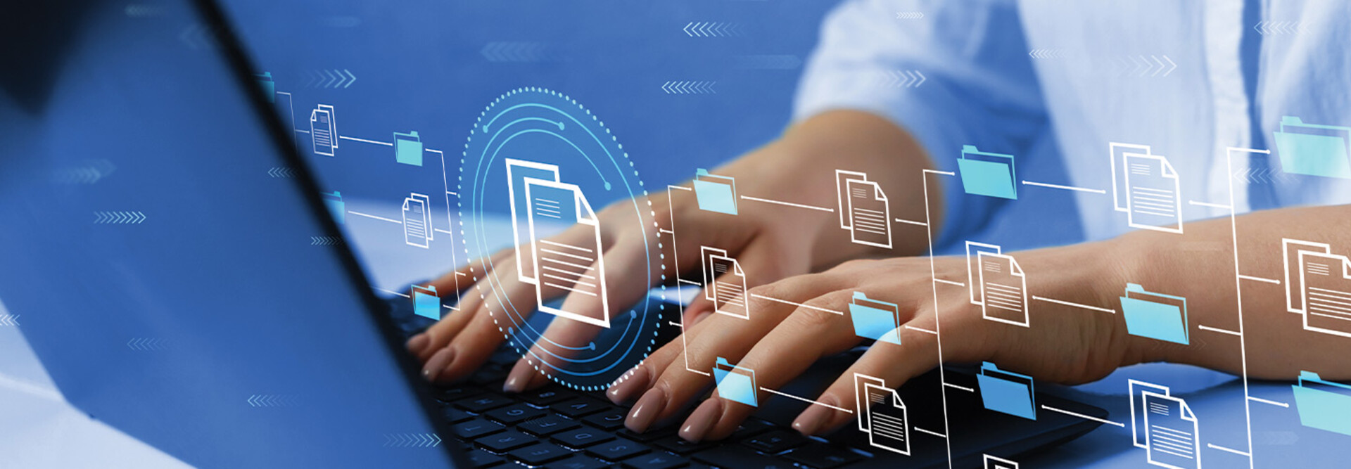 woman's hands typing on laptop