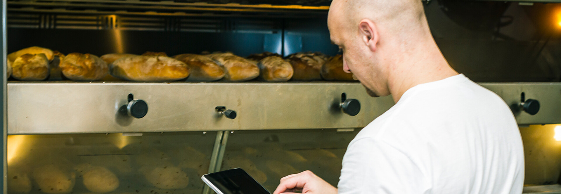 Baker using digital tablet