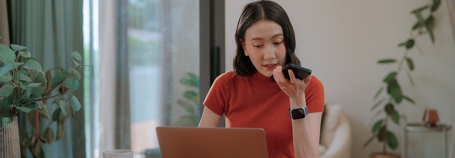 Person using phone and computer