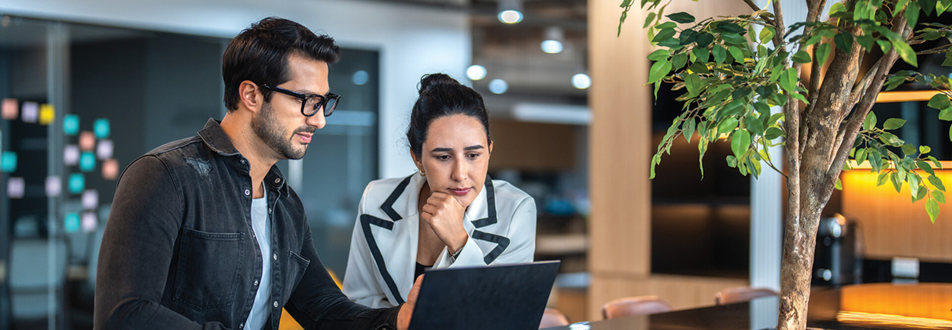 two small business owners on a laptop