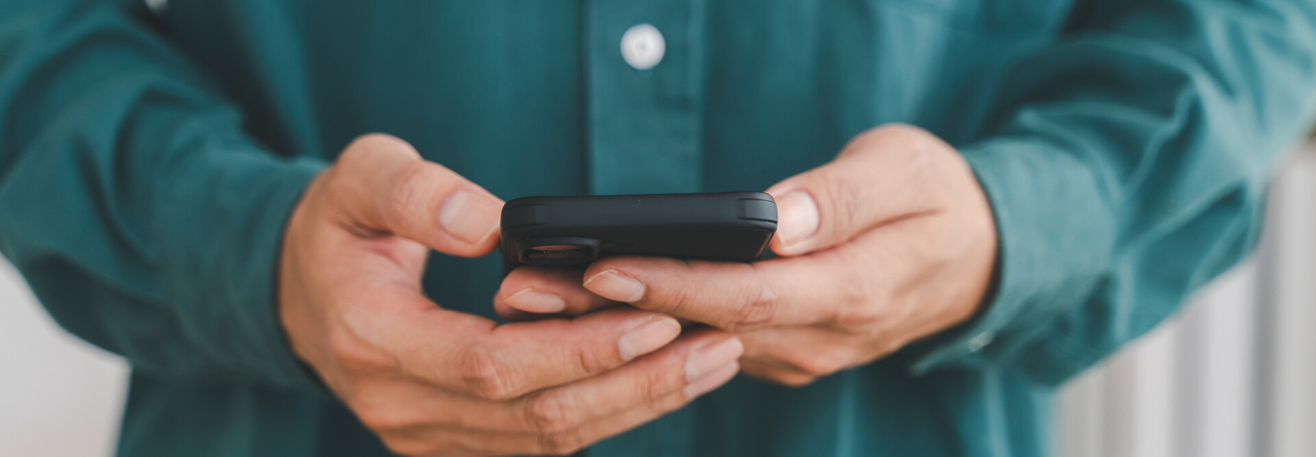Businessman holding smartphone