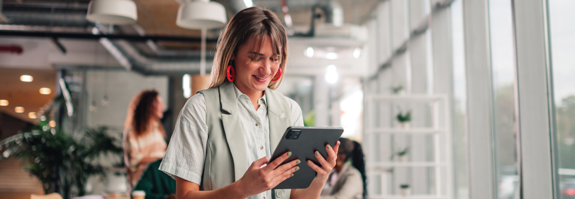 Businesswoman using tablet in modern office