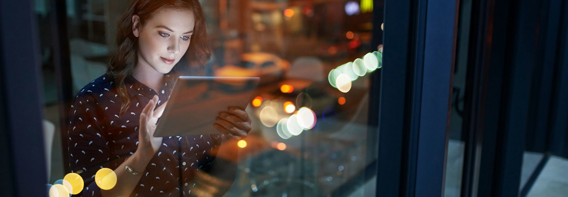 woman using a tablet in an office