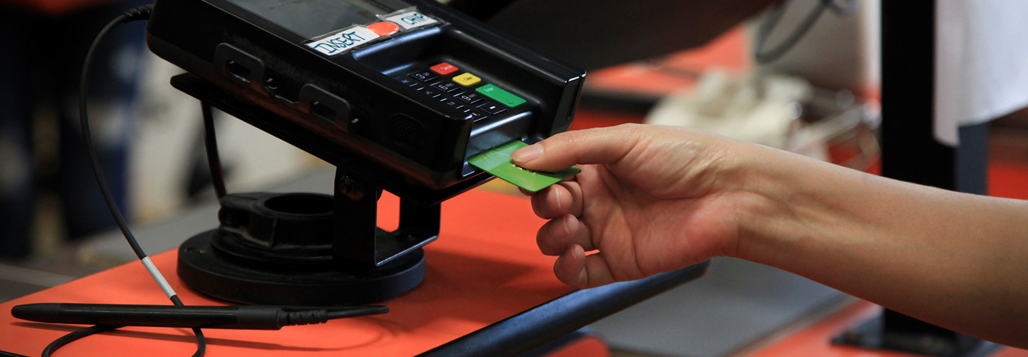 Woman using a smart card to make a purchase 