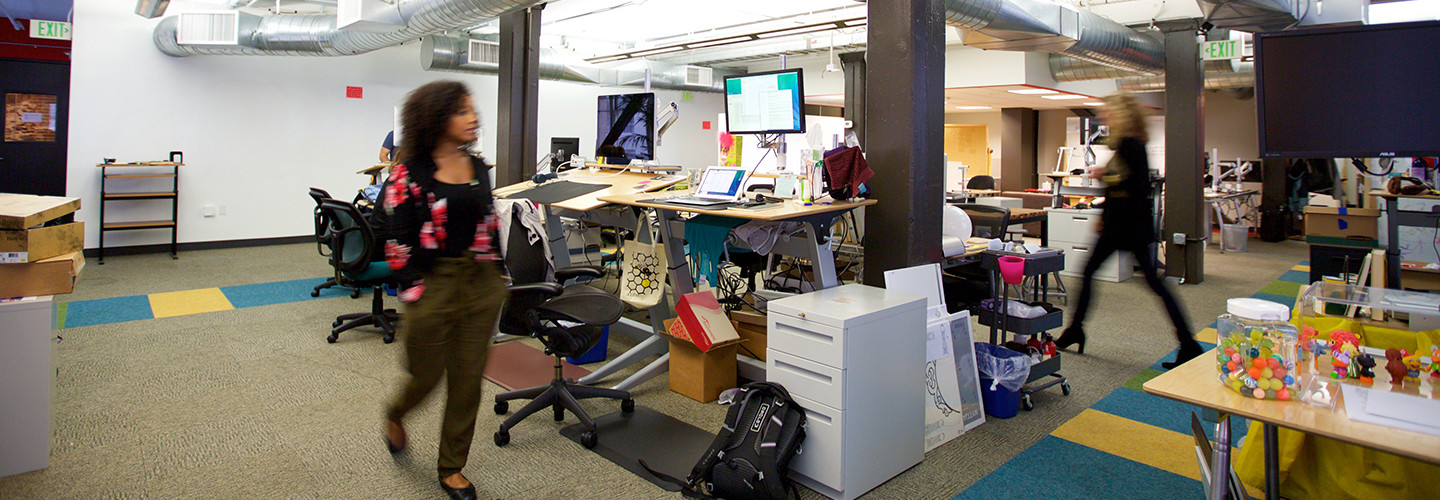 A  wide angle photo people in of the office of the nonprofit Wikimedia Foundation in San Francisco.