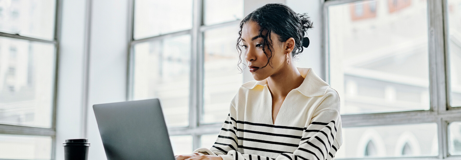 Person using laptop in the office