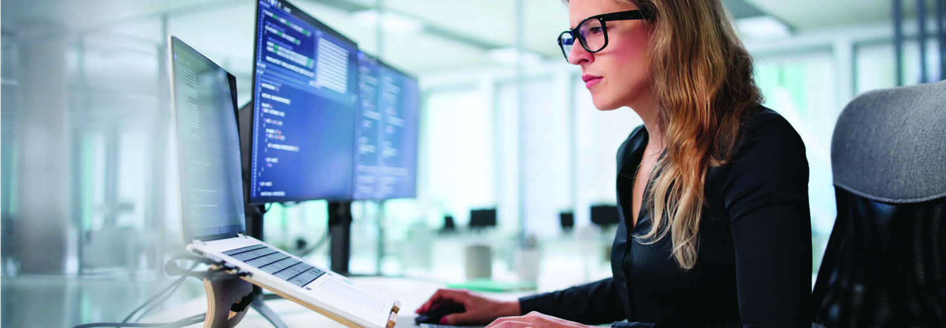 Employee reading computer screen