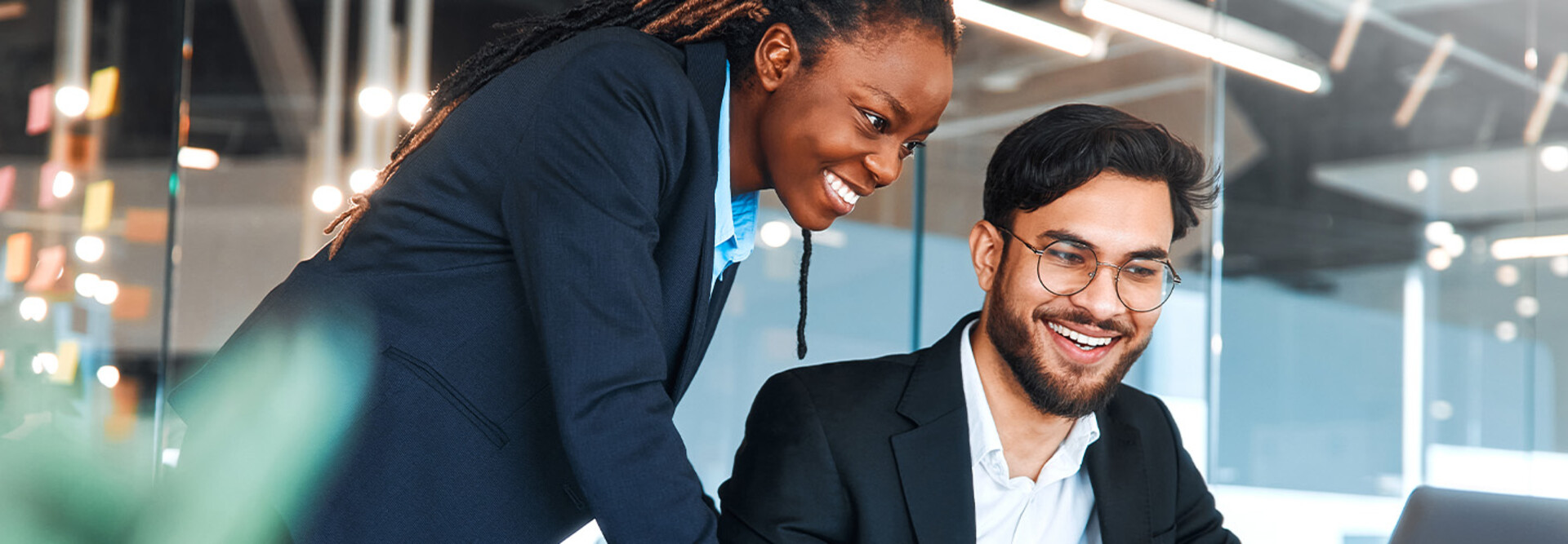 IT leaders working together in office space