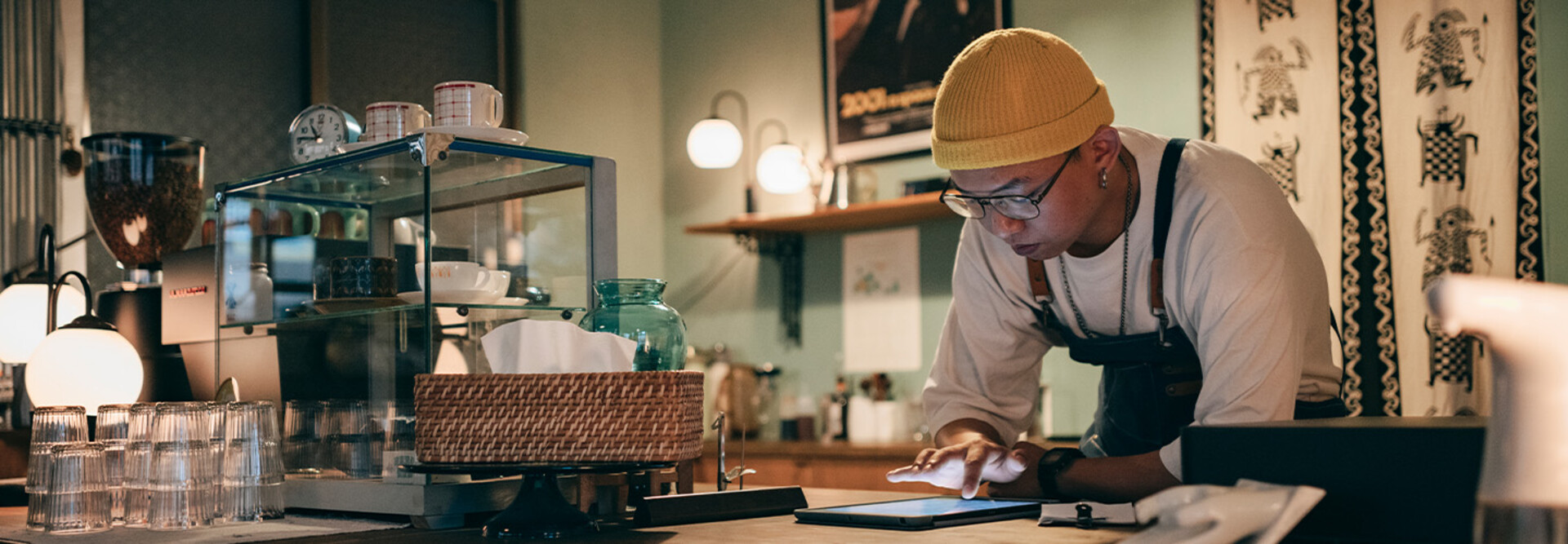 Cafe owner using technology