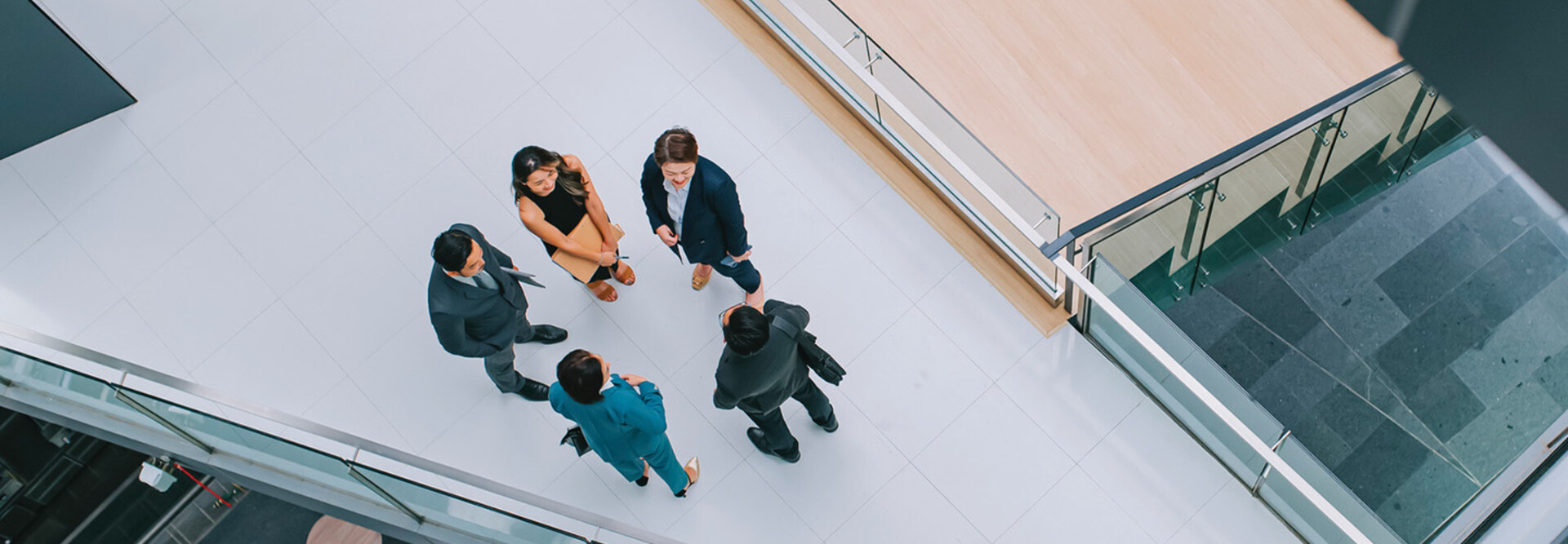 Business leaders gathered in a hallway