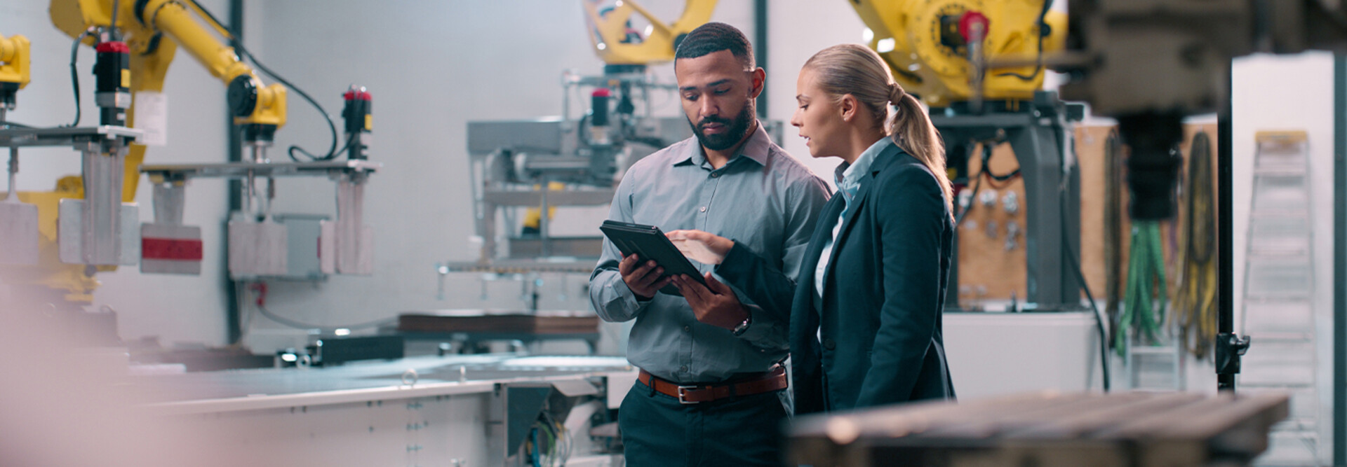 People talking in manufacturing plant