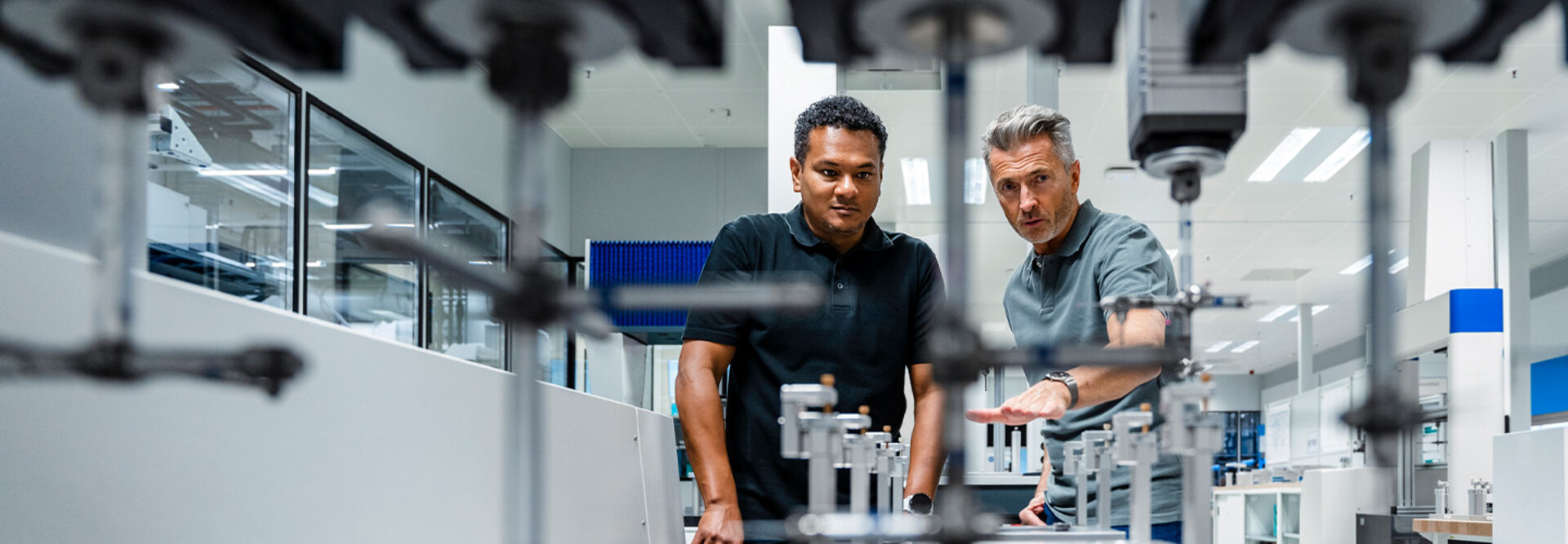 Coworkers discussing manufacturing