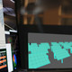 Man with multiple monitors charts