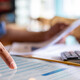 Person calculating business expenses