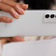 Person depositing check with cell phone
