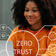 Person using computer and tablet with zero trust icon