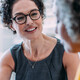 Two females talking in an office
