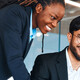 IT leaders working together in office space