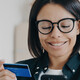 Person paying with card and a phone