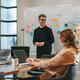 Person leading a meeting in the office