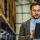 man on tablet in warehouse