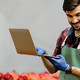 botanist uses laptop in the field