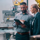 People talking in manufacturing plant