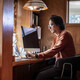 Man looking serious at a computer